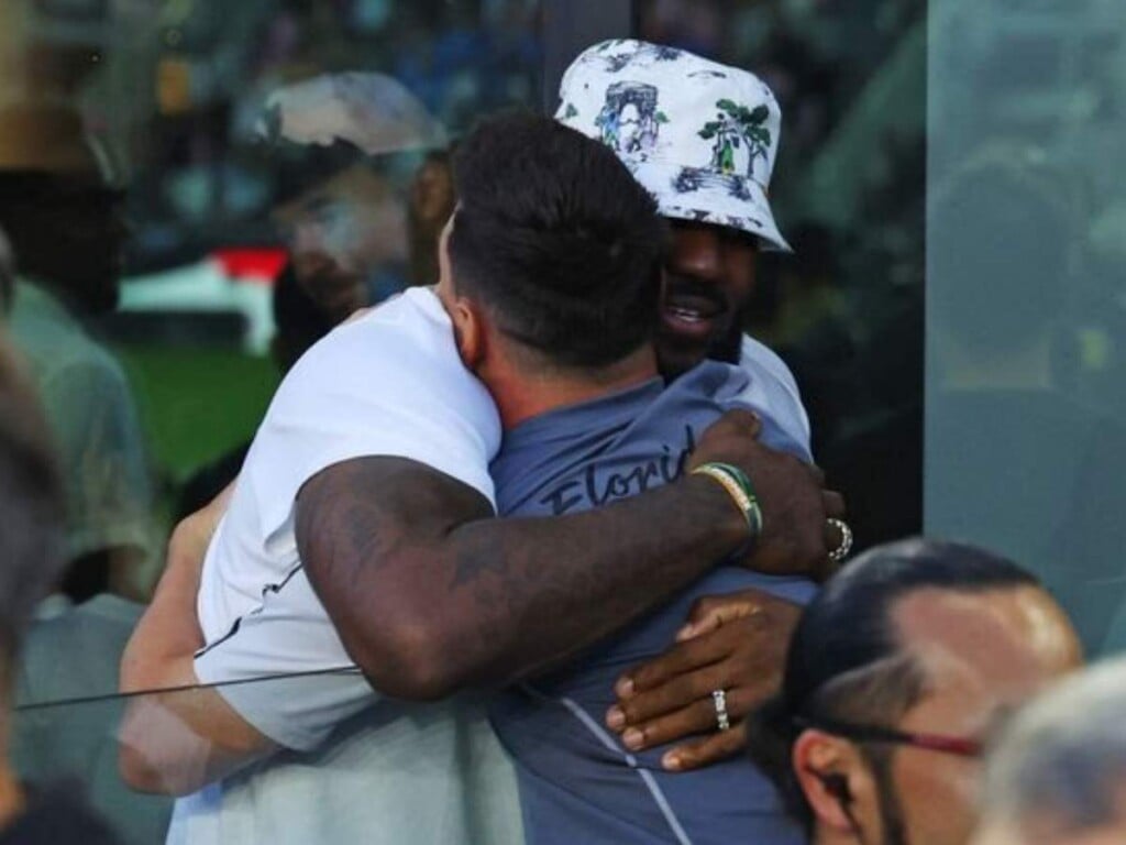 Lebron and messi hug