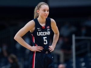 Fans are shook at Paige Bueckers' no-look half-court shot