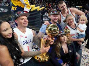 Nikola Jokic celebrates with his family after winning the NBA Championship last season for the Denver Nuggets