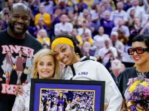 Angel Reese with Shaquille O'Neal on her senior day