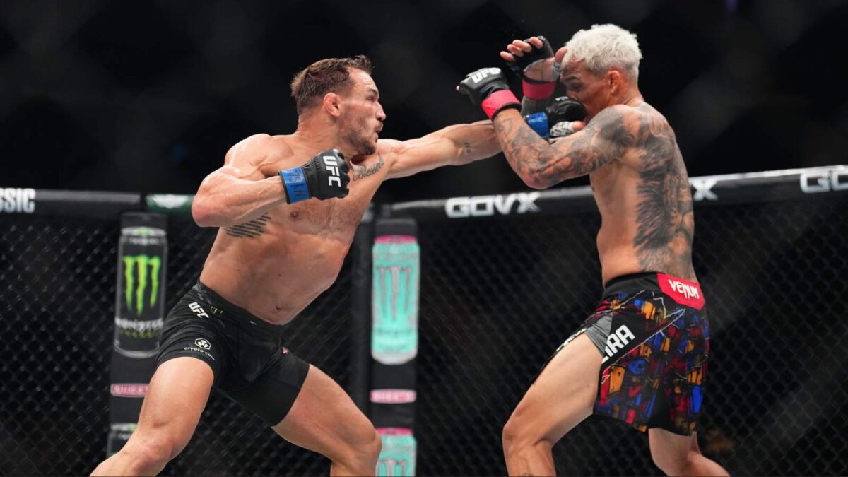 Charles Oliveira reacts to getting dazed by Michael Chanlder in fifth round of UFC 309