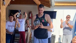 Nikola Jokic with MVP trophy at his Serbian home/house